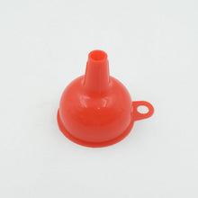 Silicone funnel in use for pouring liquids and grains